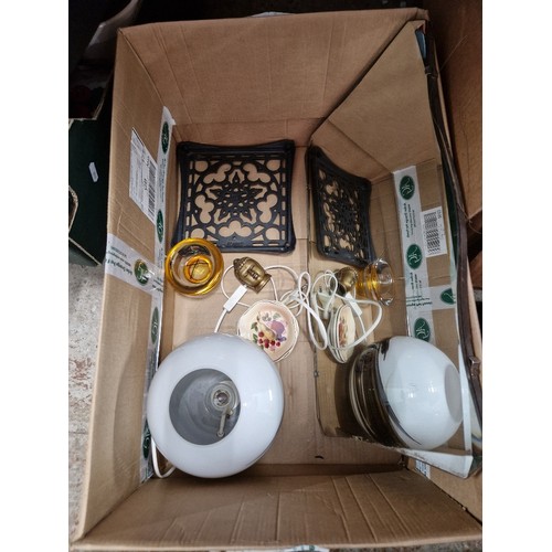 270 - A box of assorted items including a Tibetan buddha head, a mirror glass etc.