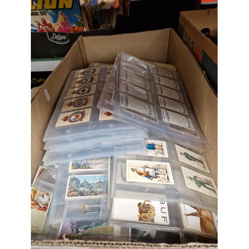 283 - A box containing folders of cigarette cards and some others including full sets.