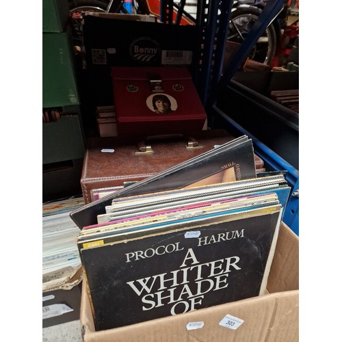 303 - A box and a case of vinyl LP records and a case of singles, various artists and genres.