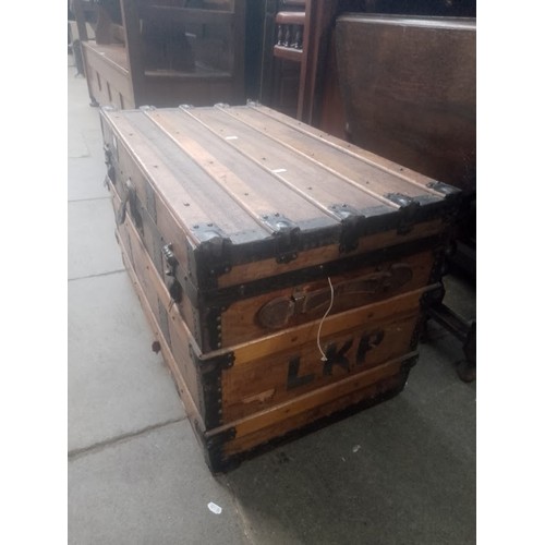 929 - A vintage leather bound travel trunk.