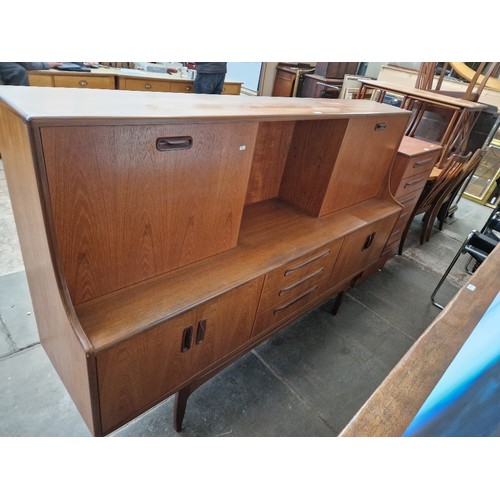 934 - A mid 20th century G Plan teak highboard.