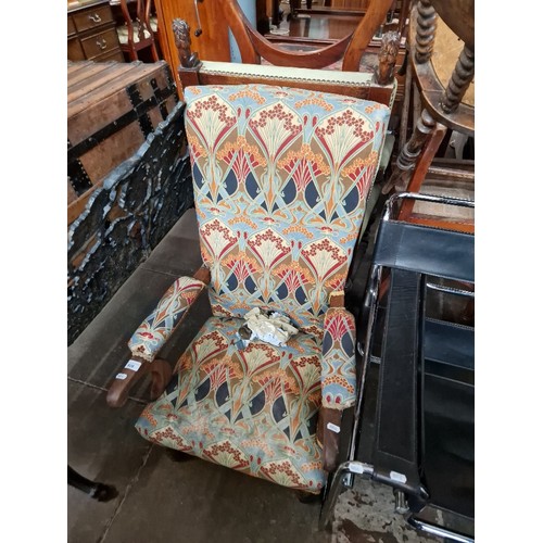 928 - An early 20th century mahogany armchair with Arts & Crafts style upholstery.