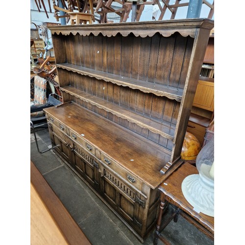 926 - An aged oak Welsh dresser, width 198cm.