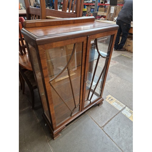 930 - A 1930s Art Deco walnut display cabinet.