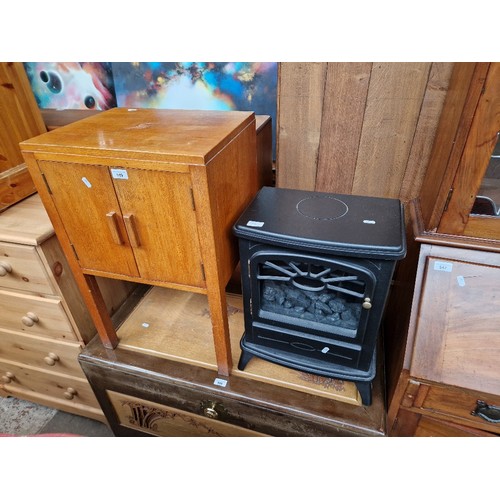 949 - A teak record cabinet and an electric fire.