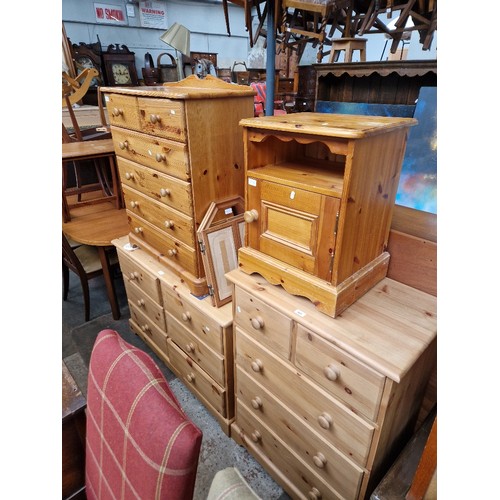 950 - Various items of pine furniture; three chests of drawers, a bedside cabinet and a triple mirror.