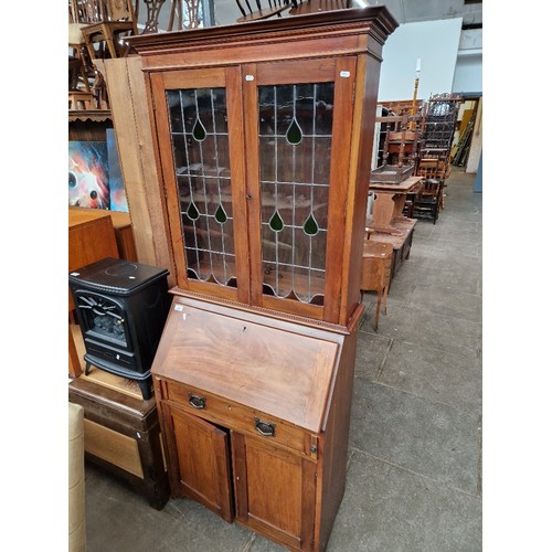 947 - An Edwardian mahogany bureau bookcase with leaded glass to the doors.