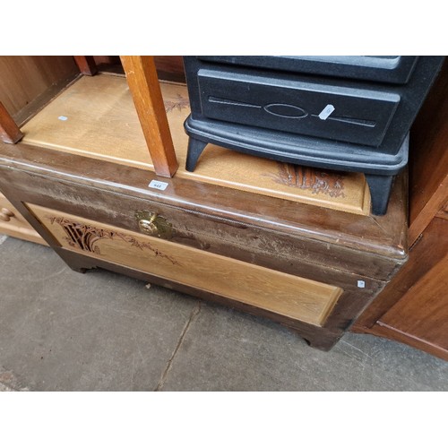 948 - A Chinese carved camphorwood chest.