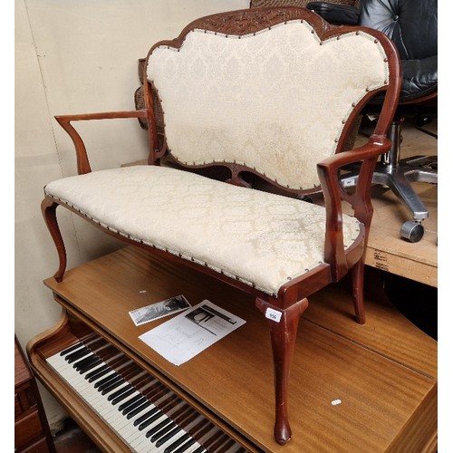 956 - An early 20th century mahogany framed two seater settee.