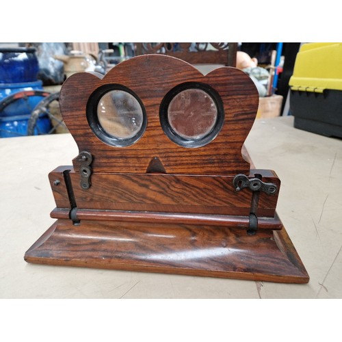 148 - A Victorian walnut stereo viewer.