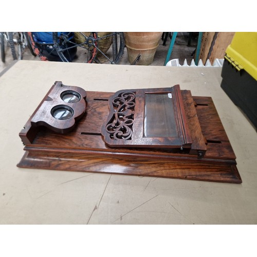 148 - A Victorian walnut stereo viewer.