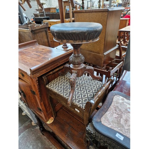 961 - A Victorian revolving piano stool and another.