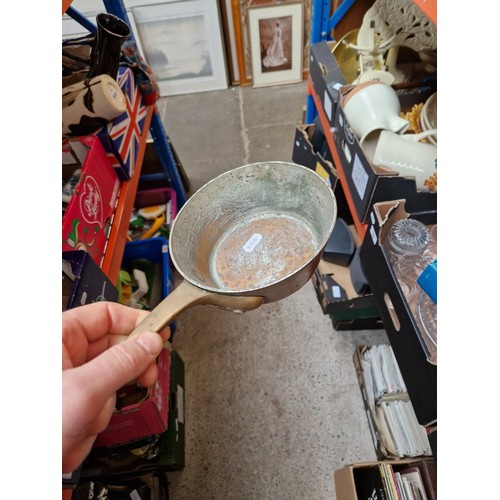 285 - A box of metalware including Swiss copper pan, Victorian and later pans, enamelled, etc.