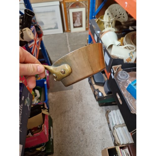 285 - A box of metalware including Swiss copper pan, Victorian and later pans, enamelled, etc.