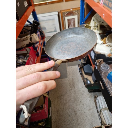 285 - A box of metalware including Swiss copper pan, Victorian and later pans, enamelled, etc.