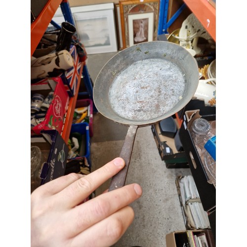 285 - A box of metalware including Swiss copper pan, Victorian and later pans, enamelled, etc.