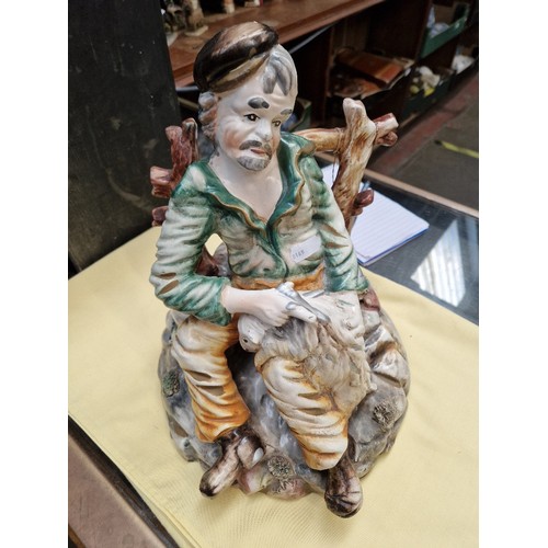 17 - A large Capodimonte figure together with a good collection of cottages to include Lilliput Lane and ... 