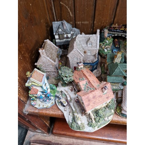 17 - A large Capodimonte figure together with a good collection of cottages to include Lilliput Lane and ... 