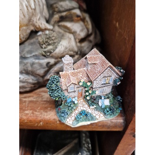 17 - A large Capodimonte figure together with a good collection of cottages to include Lilliput Lane and ... 