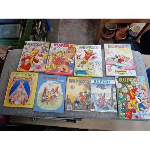 266 - Four boxes of assorted books to include Rupert annuals, including a 1970 copy, Beatrix Potter & a bo... 