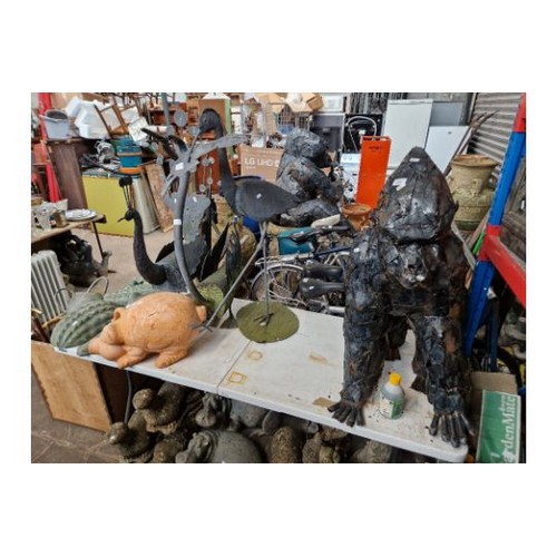 209 - A selection of metal and pottery garden ornaments to include a Silverback Gorilla, Peacock, Heron, P... 