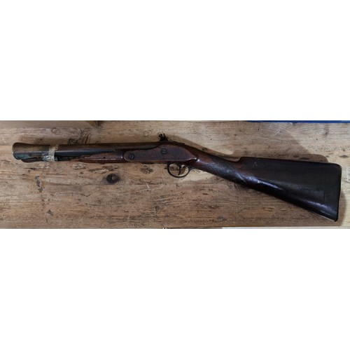 74 - An early 19th Century Flintlock Blunderbuss by Sutherland, the 31cm brass barrel engraved LONDON, wi... 