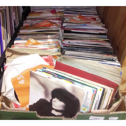 283 - A box of assorted 45s.