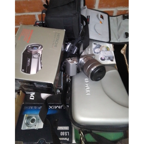 294 - Seven boxes of assorted camera equipment and binoculars.