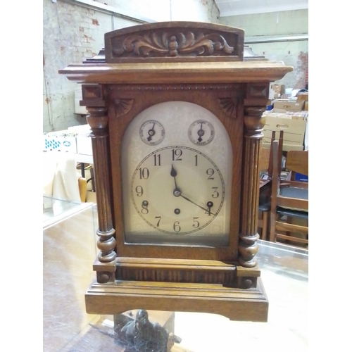 312 - An oak cased bracket clock, height 45cm.