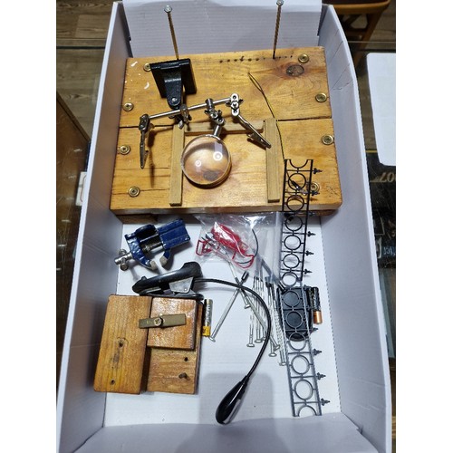 405 - A box of model making tools and equipment including clamps, clips, screwdrivers, magnifying glass, e... 