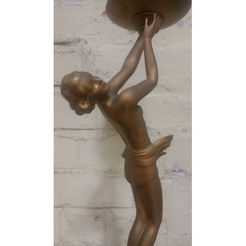 87 - An Art Deco bronze effect table lamp, height 44cm.