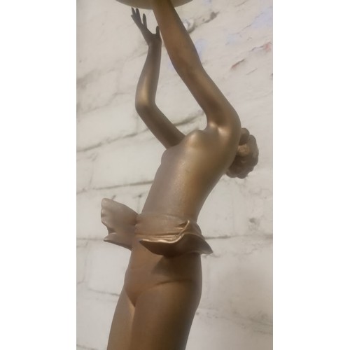 87 - An Art Deco bronze effect table lamp, height 44cm.