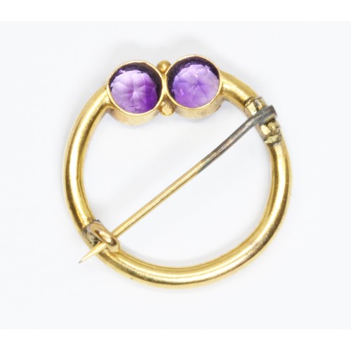 13 - An early 20th century amethyst and split pearl brooch, unmarked, diameter 25mm, gross weight 3.3g.