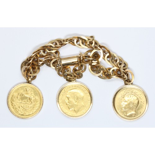 29 - A bracelet set with two Iranian pahlavi coins: 1942 & 1946 and a George V 1926 sovereign, two mount ... 