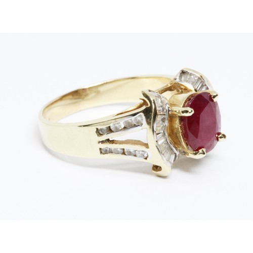 35 - A ruby and diamond ring, the band marked '14K', gross weight 6.7g, size S.