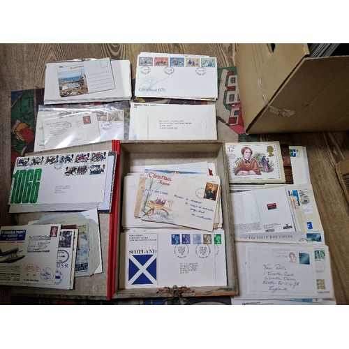 253 - A box of assorted mint presentation packs and FDCs etc.