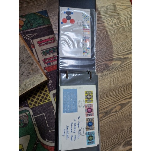 253 - A box of assorted mint presentation packs and FDCs etc.