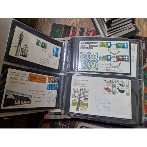 253 - A box of assorted mint presentation packs and FDCs etc.