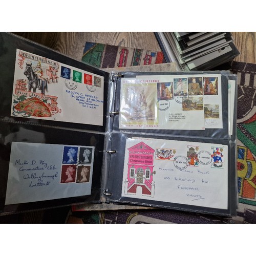 253 - A box of assorted mint presentation packs and FDCs etc.