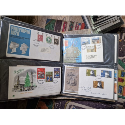 253 - A box of assorted mint presentation packs and FDCs etc.