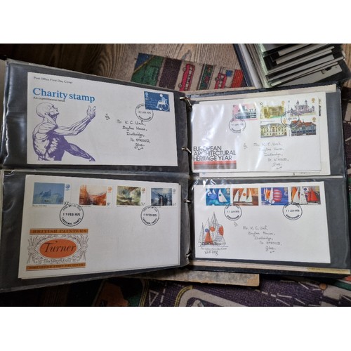 253 - A box of assorted mint presentation packs and FDCs etc.