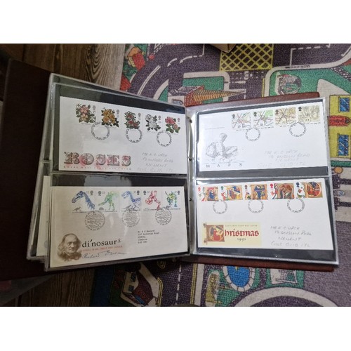 253 - A box of assorted mint presentation packs and FDCs etc.