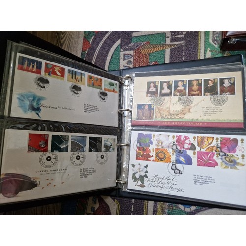 253 - A box of assorted mint presentation packs and FDCs etc.