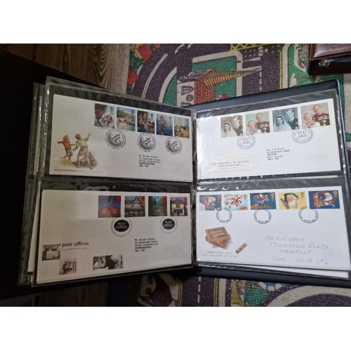 253 - A box of assorted mint presentation packs and FDCs etc.