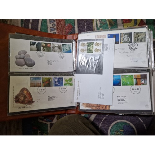 253 - A box of assorted mint presentation packs and FDCs etc.