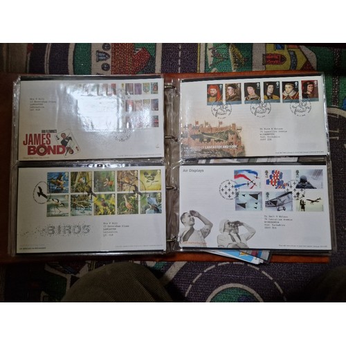 253 - A box of assorted mint presentation packs and FDCs etc.