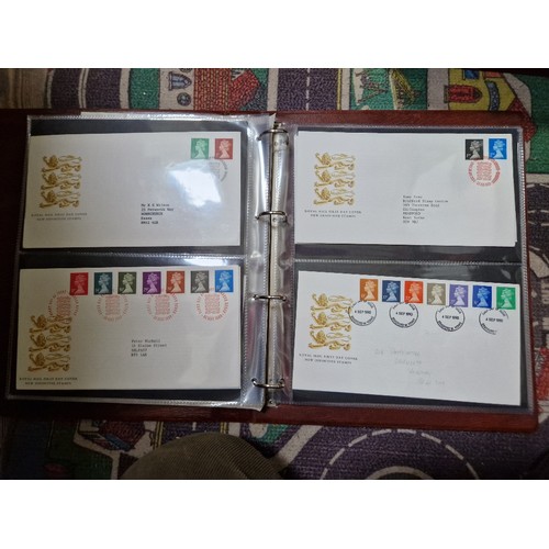 253 - A box of assorted mint presentation packs and FDCs etc.