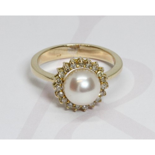 129 - A cultured pearl and diamond cluster ring, the full pearl measuring approximately 8mm in diameter, s... 