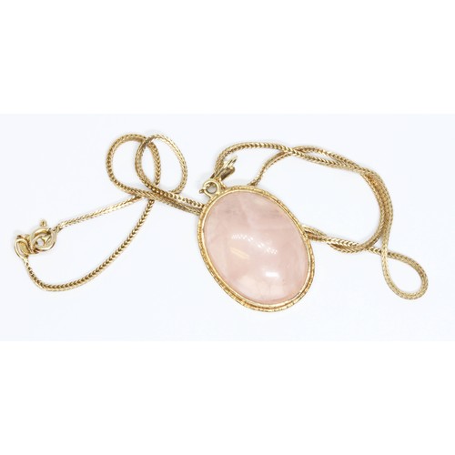 96 - A hallmarked 9ct gold rose quartz cabochon pendant on 38cm chevron link chain with 9ct gold import m... 