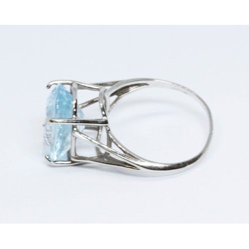 116 - A topaz ring, the oval cut stone measuring approximately 14mm x 9.90mm, depth 6.34mm, white metal ma... 